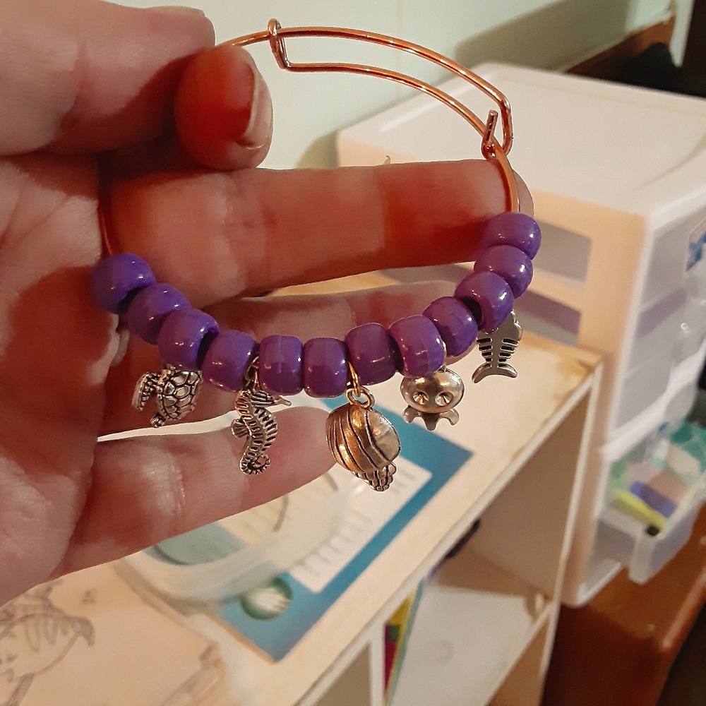 Adjustable bangle bracelet with charms